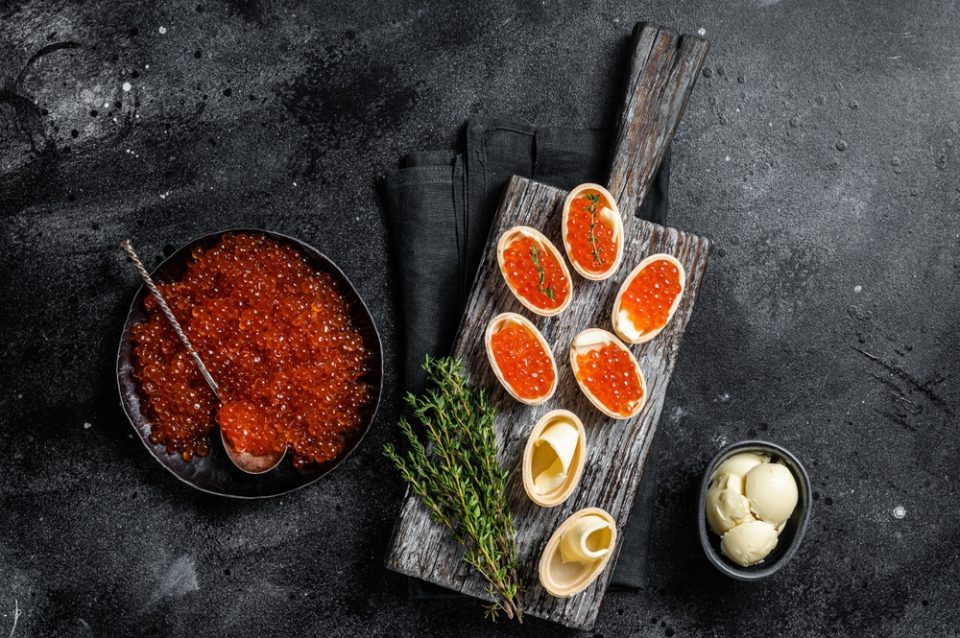 Salmon Caviar Served On Multiple Dishes